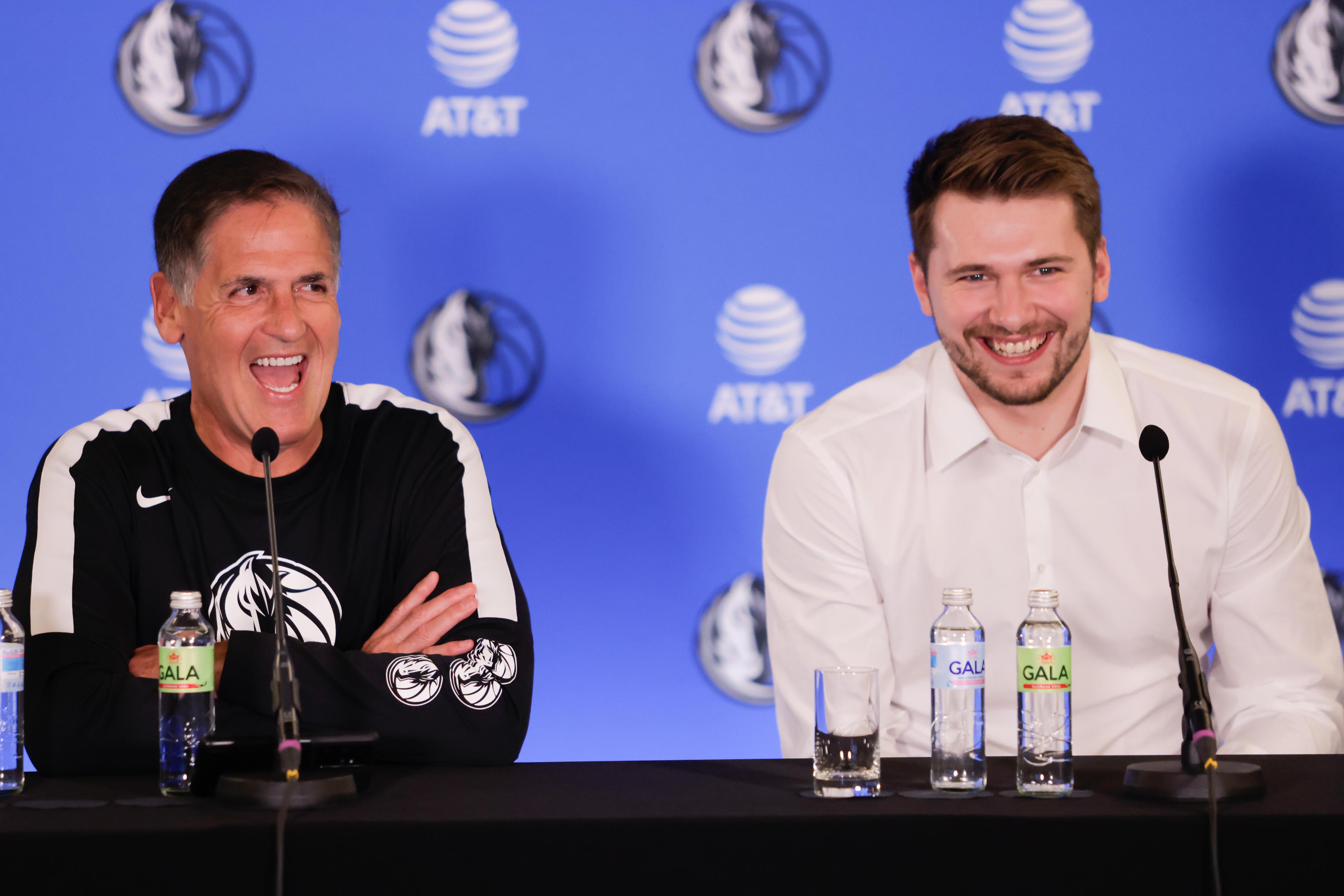 Dallas Mavericks owner Mark Cuban and Luka Doncic speak at a...